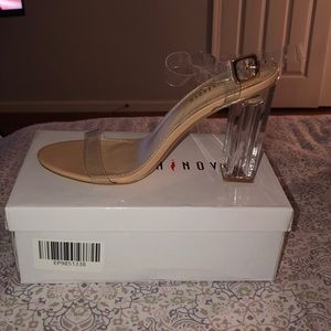Nude clear strapped pair of heels